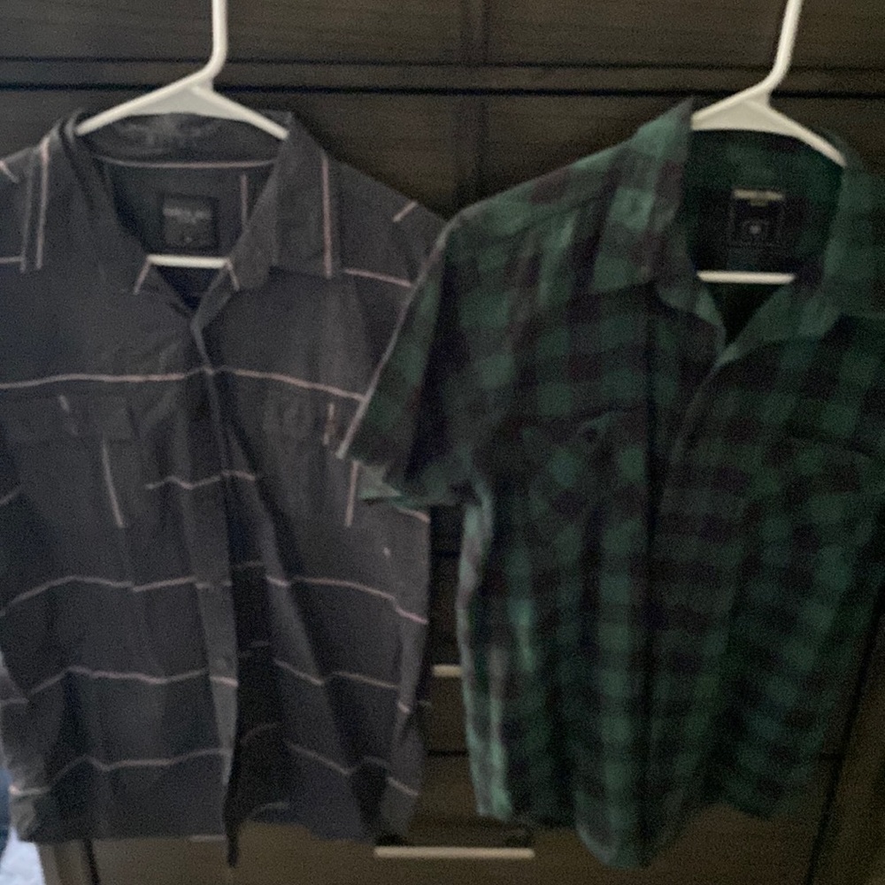 Two short sleeve button up shirts